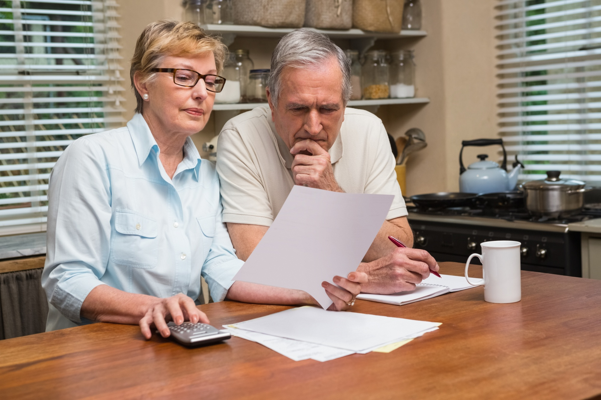 The Importance of Tenant Screening and Legal Compliance in Denver - senior couple reviewing their tenants application